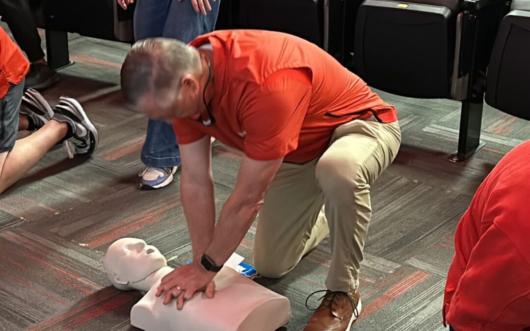 Paul “Bear” Bryant Awards Trains University of Houston Football in Hands-Only CPR